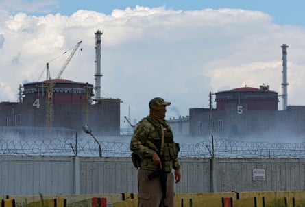 A Russian serviceman stands guard near the Zaporizhzhia nuclear power plant outside the Russian-controlled city of Enerhodar.