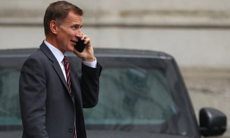 The chancellor, Jeremy Hunt, walks outside Downing Street in London