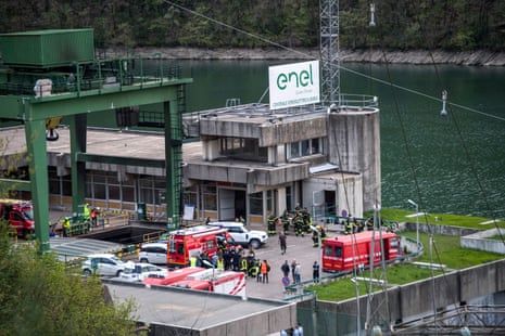 Rescuers work at the scene of an explosion that occurred in a hydroelectric power plant on the Lake Suviana reservoir, near Bologna, northern Italy