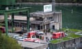 Rescuers work at the scene of an explosion that occurred in a hydroelectric power plant on the Lake Suviana reservoir, near Bologna, northern Italy