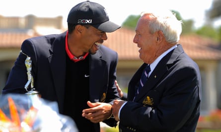 Tiger Woods and Arnold Palmer share a joke in 2013