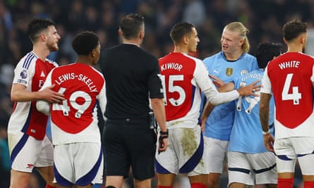 Arsenal’s Myles Lewis-Skelly clashes with Manchester City’s Erling Haaland.