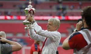 Arsenal manager Arsène Wenger with the FA Cup after victory over Chelsea in the final at Wembley stadium.