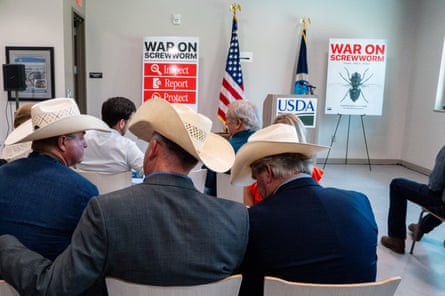 Three men in cowboy hats sitting together