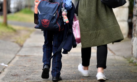 Parents collect children at St Charles’ primary school at Waverley in Sydney, Australia