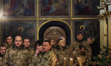 Ukrainian servicemen attend a special service for Ukrainian Armed Forces at Mikhailovsky Zlatoverkhy Cathedral (St. Michael's Golden-Domed Cathedral) in central Kyiv, Ukraine.