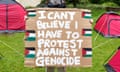 A student holds a protest message at the Palestine solidarity camp at Bristol University last Friday.
