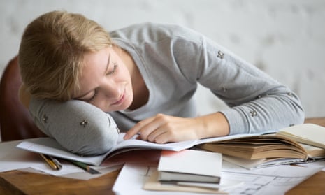 Picture of a young woman sleeping at the desk