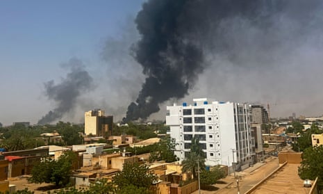 Smoke billows above residential buildings in Khartoum