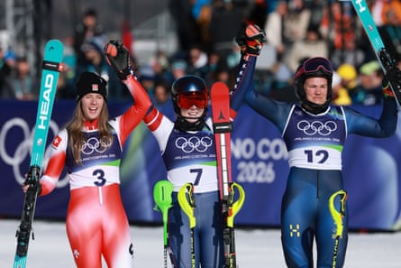 Mikaela Shiffrin (centre) celebrates with silver medallist Camille Rast (left) of Switzerland and Sweden’s Anna Swenn Larsson (right), who won bronze.