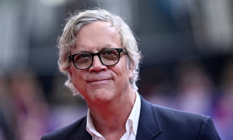 Head and shoulders shot of Todd Haynes in blue jacket, open-necked white shirt and black-rimmed glasses.