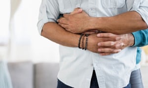 A gay couple hugging.