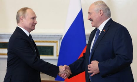 Russian President Vladimir Putin (L) shakes hands with his Belarusian counterpart Alexander Lukashenko