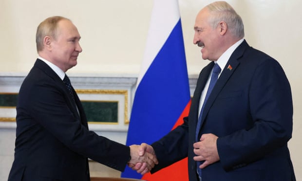 Russian President Vladimir Putin (L) shakes hands with his Belarusian counterpart Alexander Lukashenko