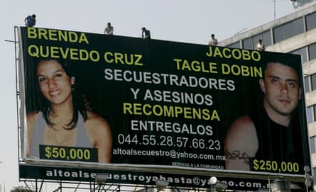 Workers put up a billboard in Mexico City in March 2006 showing Brenda Quevedo and Jacobo Tagle.