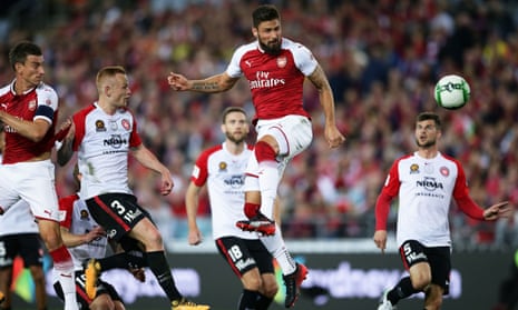 Olivier Giroud rises for a header at ANZ Stadium.