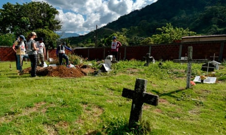 Members of the International Committee of the Red Cross (ICRC) work in the recovery of mortal remains of people killed by armed groups during the country’s armed conflict, in a cemetery in the Catatumbo jungle, in Colombia.