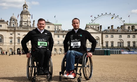David Weir and Marcel Hug pose for pictures in front at the Horse Guards Parade, during the men’s elite wheelchair press conference ahead of the London Marathon