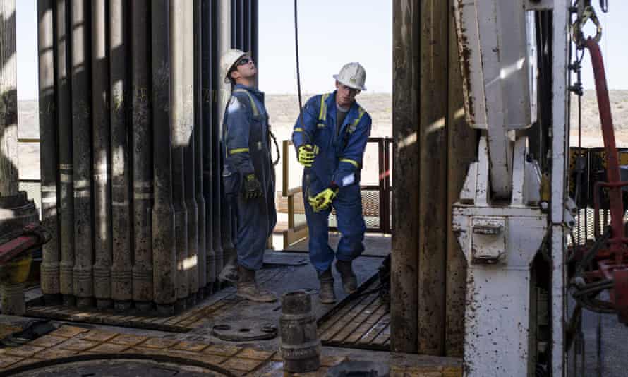 Royal Dutch Shell rig operators in Texas. Oil and gas companies have been told they could be downgraded between one and two notches as S&P increases risk rating for the entire sector.