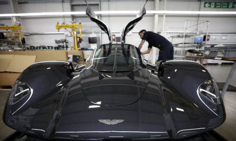 An employee works on the interior of an Aston Martin Valkyrie in 2022.
