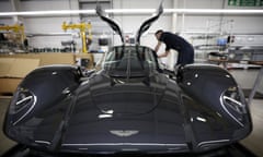 An employee works on the interior of an Aston Martin Valkyrie.