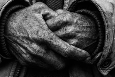 A closeup shot of a person’s hands clasped together