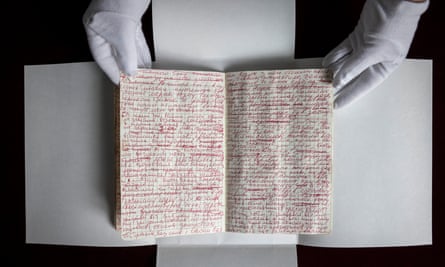 Tetiana Rud, an archivist from Kharkiv’s Literary Museum, looks at Volodymyr Vakulenko’s journal, which was found buried under a cherry tree in his father’s house in Kharkiv on 13 April 2023.