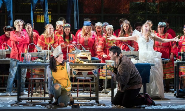 Aoife Miskelly (in yellow) in the title role with Phillip Rhodes (Mizgir) and Elin Pritchard (Kupava) and the Chorus of Opera North in The Snow Maiden. 