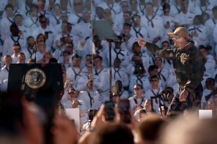 A man waves to sailors.