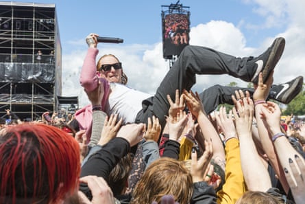 Singer Frank Carter enters the moshpit at Download 2024, Donington Park, Leicestershire.