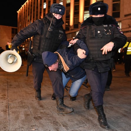 Police detain a man during a protest against Russia’s invasion of Ukraine in Moscow on Thursday.