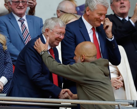 Pep Guardiola is congratulated by Sir Alex Ferguson after winning the 2023 FA Cup final