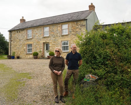 Amanda Hutton and Richard Burton outside Fox Hill farmhouse in Pembrokeshire, west Wales.