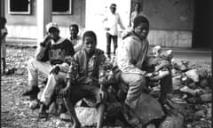 Boys in front of a destroyed school in Camacupa, Angola.