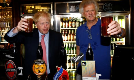 Boris Johnson during a visit to Wetherspoons Metropolitan Bar in London with Tim Martin, chairman of JD Wetherspoon, in July 2019.