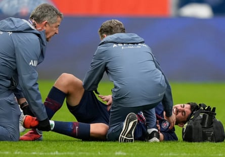 Medics taking care of PSG’s Lucas Beraldo who was injured against Lens