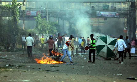 Bangladesh Nationalist party activists light a fire during a rally