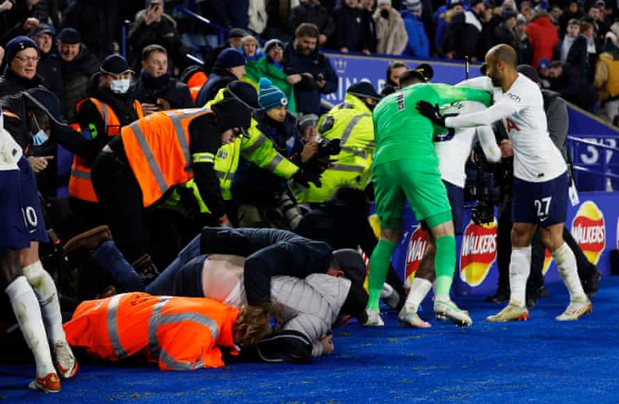 Stewards and fans collapse in a heap as Steven Bergwijn celebrates scoring Tottenham’s third goal against Leicester following a remarkable late comeback