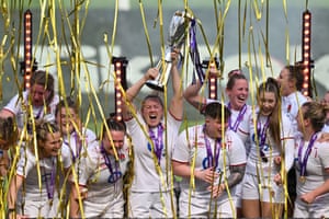 England’s teammates celebrate with the trophy after winning the Women’s Six Nations Grand Slam at the end of the Six Nations international women’s rugby union match between England and France at Twickenham