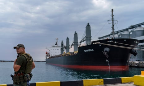 A security guard in Odesa near a ship carrying grain last year