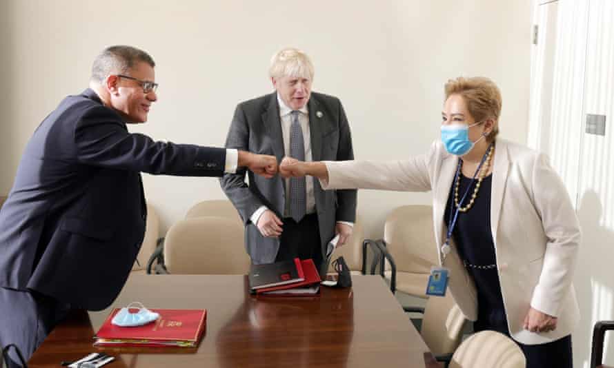 The UK prime minister, Boris Johnson (centre) and the Cop26 president, Alok Sharma (left), meeting with the executive secretary of the UN Framework Convention on Climate Change (UNFCCC), Patricia Espinosa, at the UN building in New York on 20 September 2021