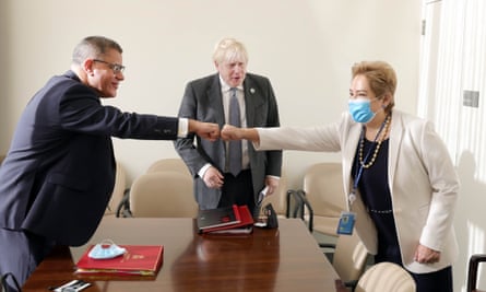 The UK prime minister, Boris Johnson (centre) and the Cop26 president, Alok Sharma (left), meeting with the executive secretary of the UN Framework Convention on Climate Change (UNFCCC), Patricia Espinosa, at the UN building in New York on 20 September 2021
