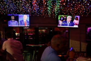 Viewers watch the dueling town halls at a restaurant in Tampa, Florida.