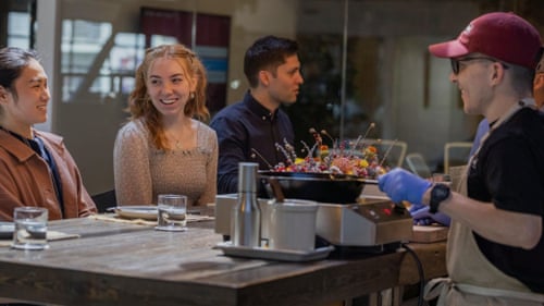 People are seated in a tasting room.