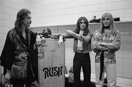 Rush backstage in Springfield, Massachusetts, 9 December 1976 during their All The World’s a Stage tour.