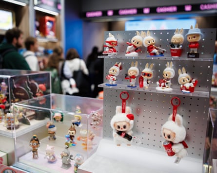 People queue in the first Pop Mart store selling Labubu toys in Berlin, Germany.