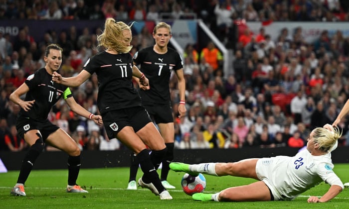 England’s striker Alessia Russo (right) is unable to get a clean shot away.