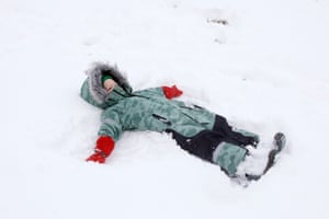 Francis makes a snow angel.
