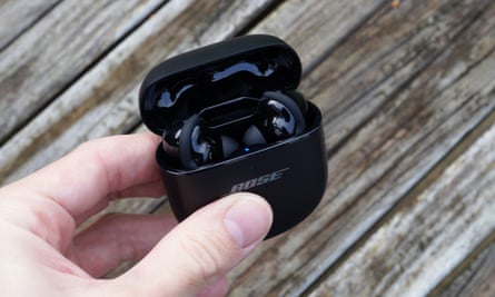 The Bose QuietComfort Ultra earbuds in their charging case.