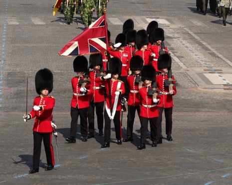 Members of the British Armed Forces take part in the Bastille Day military parade on Champs-Elysees Avenue, in Paris, France.